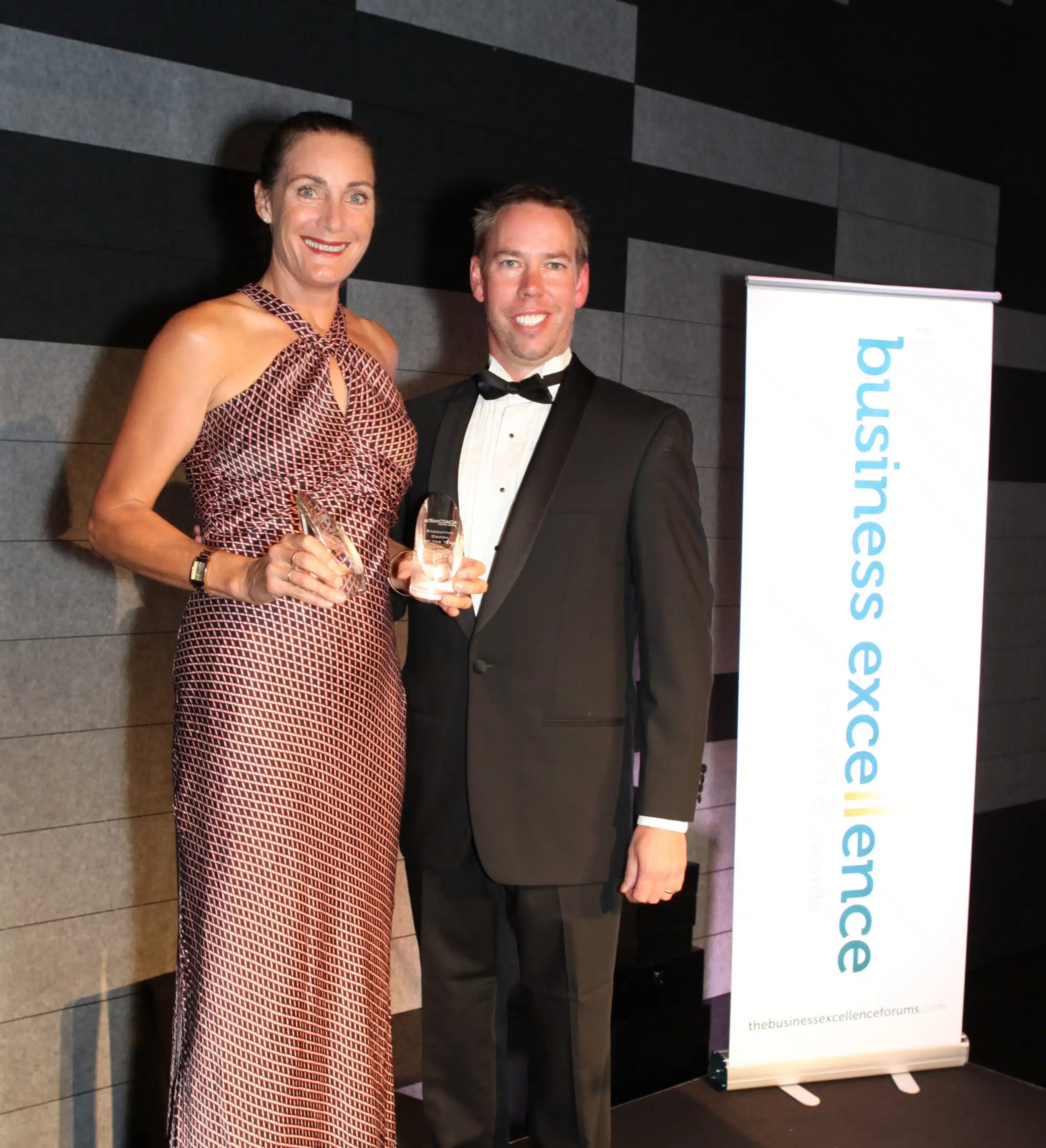 Photo of Suzzanne Laidlaw female business coach winning an excellence award with her Tenfold business coach Ashley Thomson